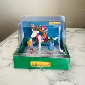 Lemax Village Collection figurine called "Storybook Santa".